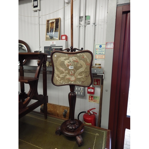 2069 - A 19th Century rosewood pole screen with oriental silk work panel   (R) £30