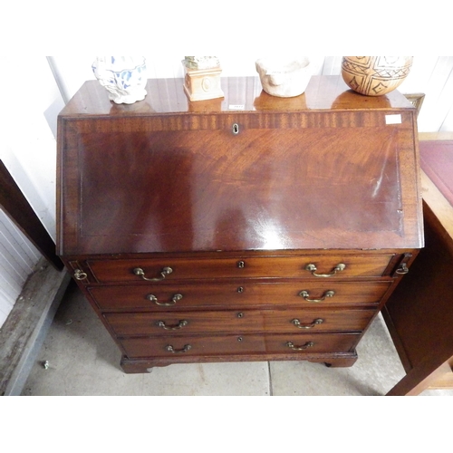 2077 - A Georgian mahogany bureau with fitted pigeon hole, cupboard and drawer interior (veneer lifting to ... 