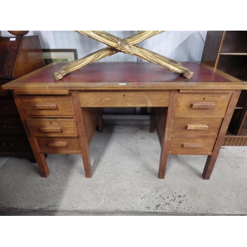 2082 - A red leather top mahogany desk