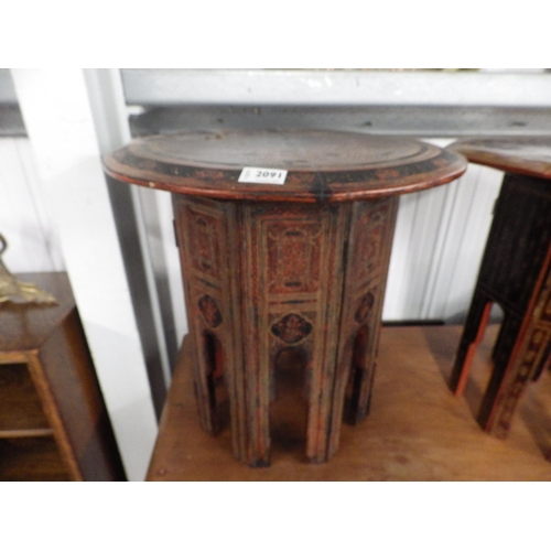 2091 - A Burmese red and black lacquered table