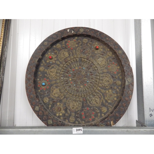 2095 - An Eastern circular wooden wall plaque with worked brass, tin and beadwork decoration