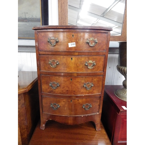 2102 - A 20th Century bow front bedside chest of four drawers, 72cm x 46cm x 40cm