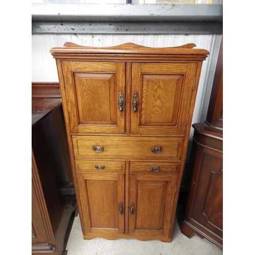 2118 - An Edwardian oak cabinet, multi doors and drawers