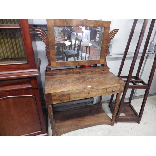 2121 - An early 19th Century mahogany dressing table with carved supports with worn Mercury mirror plate