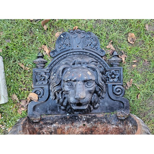 7358 - A cast iron lion mask wall mounting fountain, approx 48