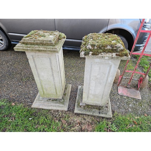 7361 - A pair of weathered composition square plinths, in three sections, 39