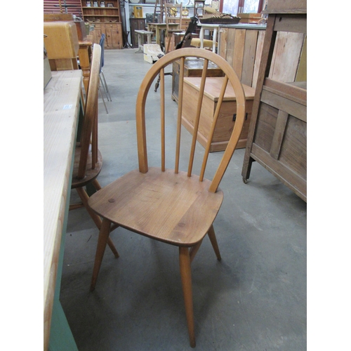 2204 - Four Ercol stick back chairs