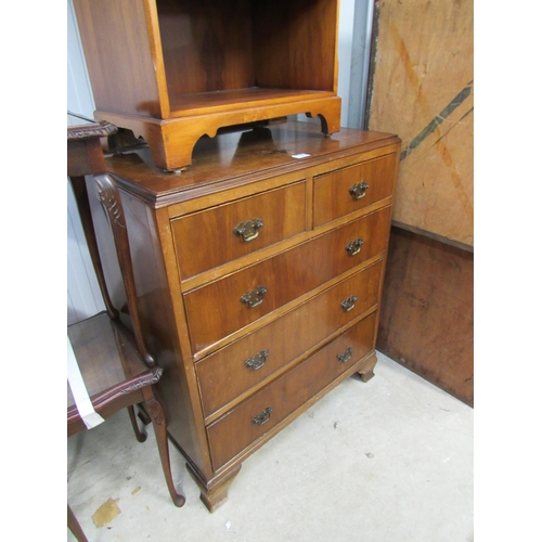 2290 - A 1940's walnut two over three chest of drawers, with brass handles