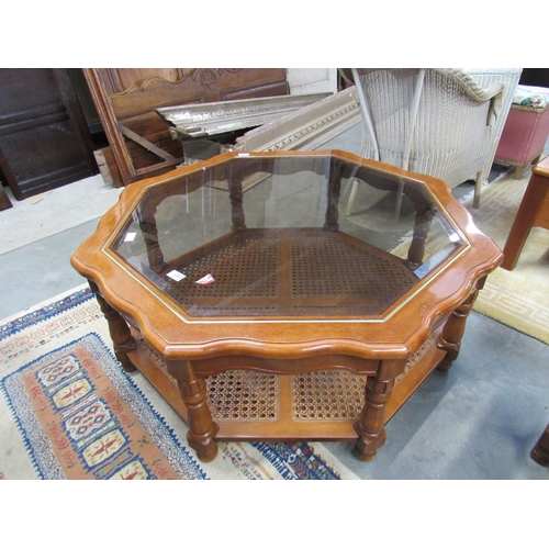 2331 - A modern octagonal coffee table with glass top and cane undertier, 37cm tall x 96cm across  (E) £10-... 