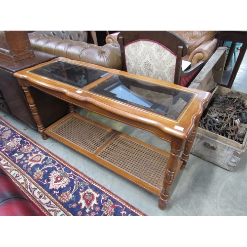 2352 - A 20th Century mahogany glass top side table with cane undertier   (E) £10-15