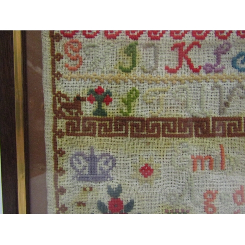 4016 - A Victorian sampler dated 1877 by Emily Clegg aged 13 years, small hole and some discolouration, fra... 