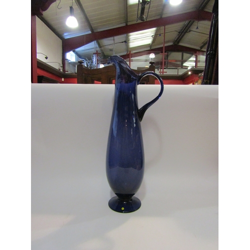 4220 - A large 20th Century indigo glass jug, 52cm tall  (R) £0  (E) £10-15