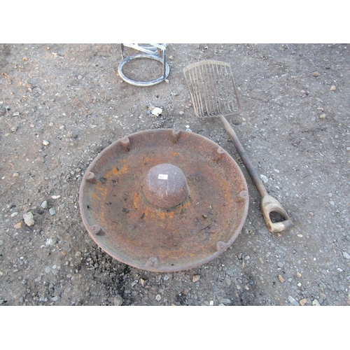 3306 - A cast circular pig trough and a potato fork