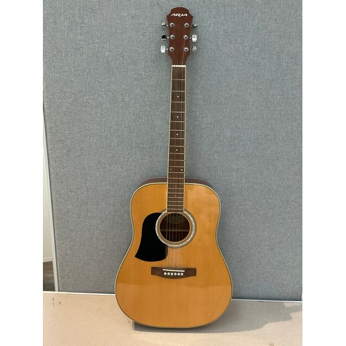 9068 - An Aria AW-20 acoustic guitar, left handed but strung for right, with soft case   (E) £25-35