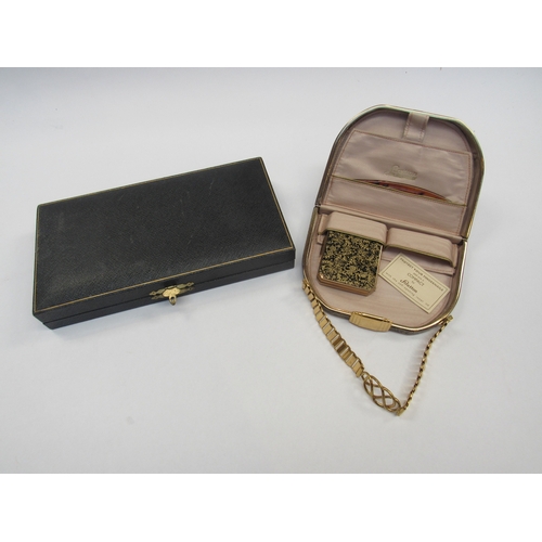 8005 - A Stratton compact, part contents and a cased manicure set