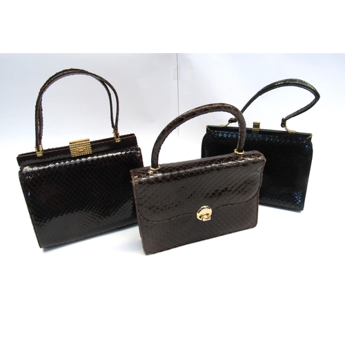 8010 - Three mid 20th Century snakeskin handbags, two brown, one black and a small quantity of ladies glove... 