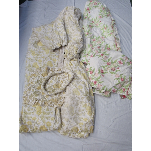 8028 - A pair of chintz pale lemon, green and white floral curtains with plaited tie-backs, a cotton bedspr... 