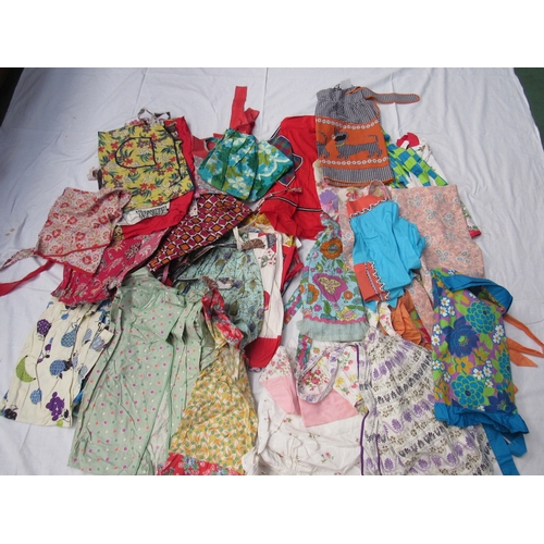 8033 - Forty approx colourful printed cotton 1930's - 1960's mainly waist aprons of various design