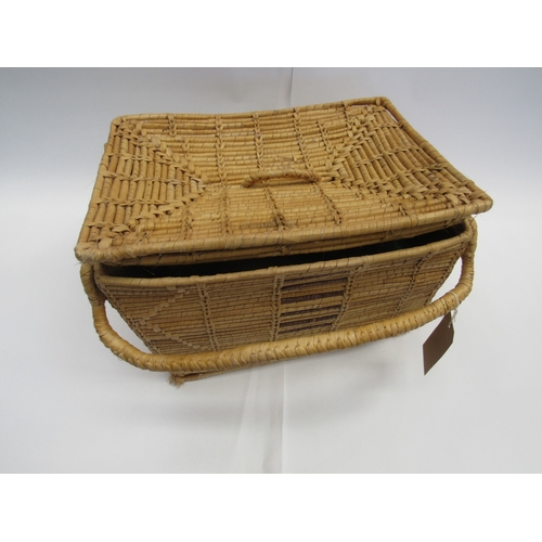 8042 - A vintage raffia picnic basket containing mid 20th Century fashion accessories to include a raffia a... 