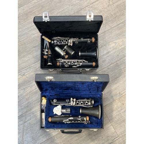 9092 - Two cased clarinets including Earlham & Lindo (damage to latter)