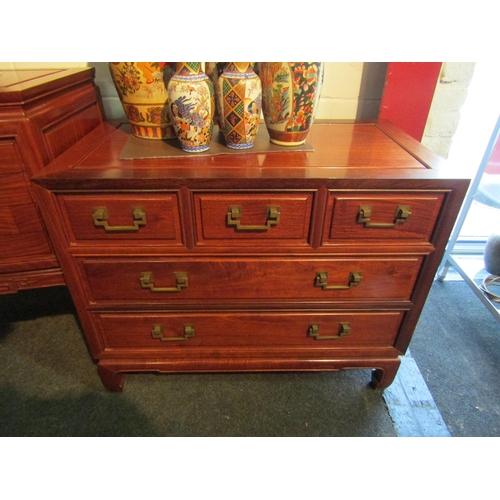 1007 - A Chinese elm chest of three short over two long drawers on shaped foot base, 65cm tall x 81cm wide ... 