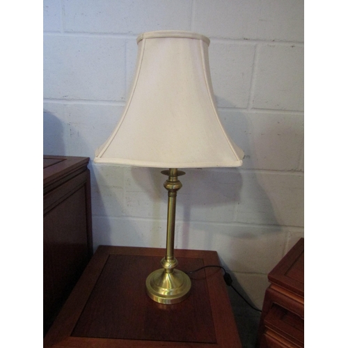 1014 - A pair of brass table lamps with shades