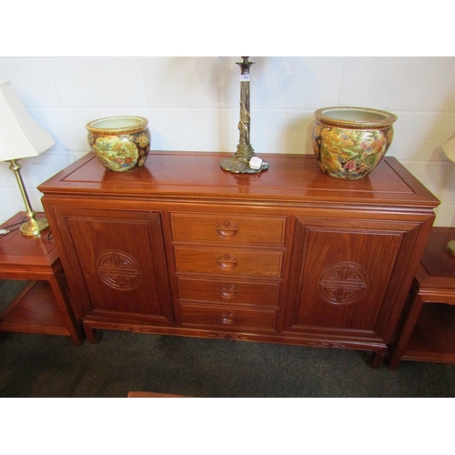 1022 - A Chinese elm sideboard with four central drawers and two 