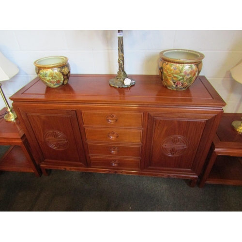 1022 - A Chinese elm sideboard with four central drawers and two 