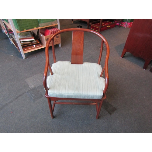 1023 - A Chinese elm yolk back armchair    (R) £30