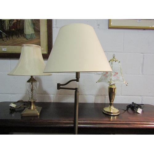 1038 - An articulated standard lamp and two metal table lamps, one having cut glass body section (3)