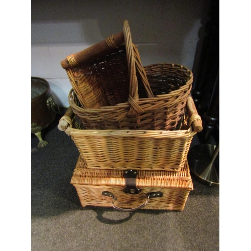 1041 - A picnic hamper (near complete) together with three wicker baskets (4)