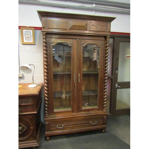 1046 - A circa 1880 fruitwood two glazed door armoire with barley twist columns and key, 217cm tall x 127cm... 