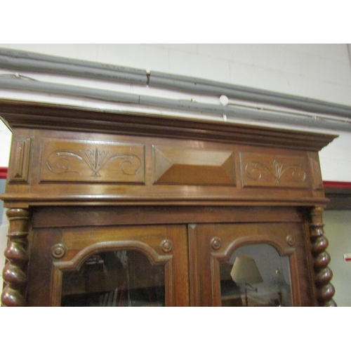 1046 - A circa 1880 fruitwood two glazed door armoire with barley twist columns and key, 217cm tall x 127cm... 