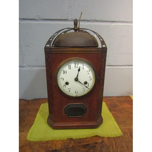 1519 - An oak cased mantel clock striking on a bell, bell 16cm diameter