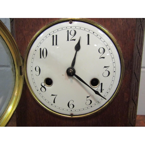 1519 - An oak cased mantel clock striking on a bell, bell 16cm diameter