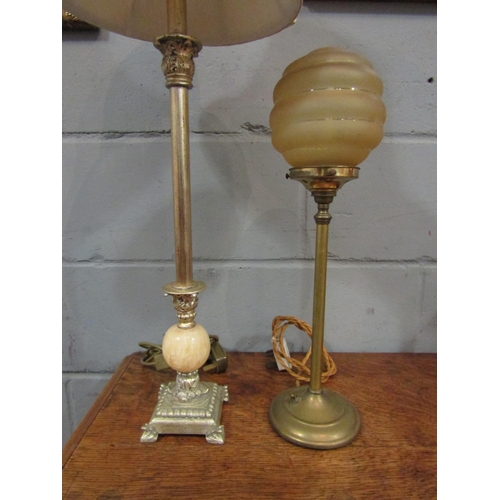 1055 - An Art Deco style brass table lamp with globular shade together with another (2)