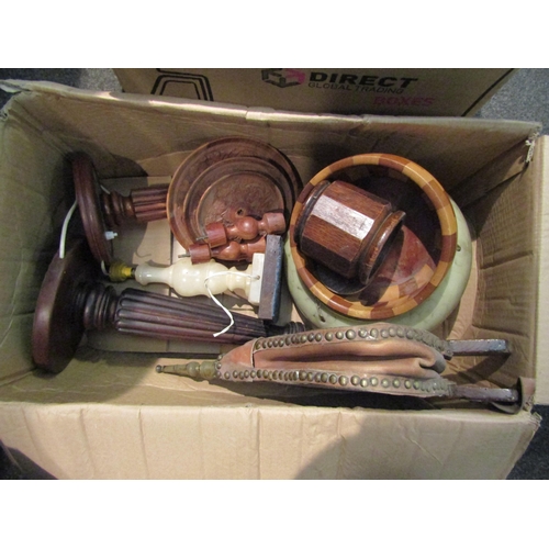 1073 - Two boxes of mostly wooden and metal wares including a pair of bellows, table lamp bases, Cambridge ... 