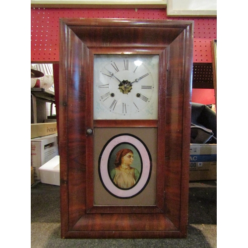 1080 - An American wall clock with Roman numerals and glass panel depicting female, with pendulum and key