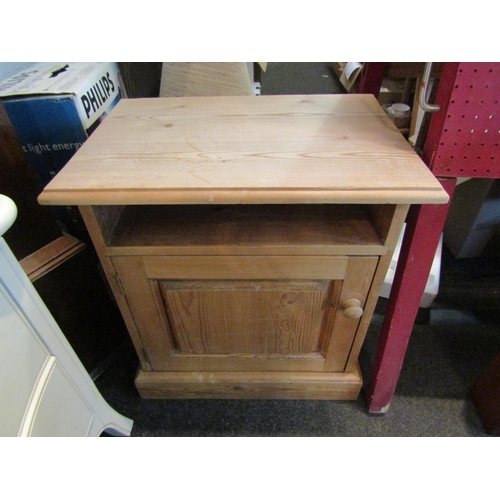 1082 - A pine bedside cabinet, 60cm tall x 55cm wide x 38cm deep