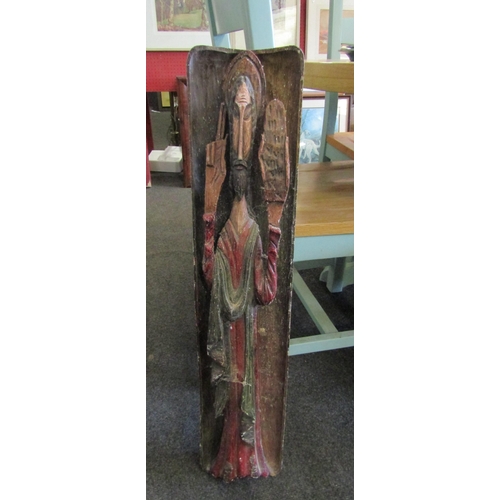 1096 - A carved wooden panel depicting a sage, arm broken, 80cm x 17cm