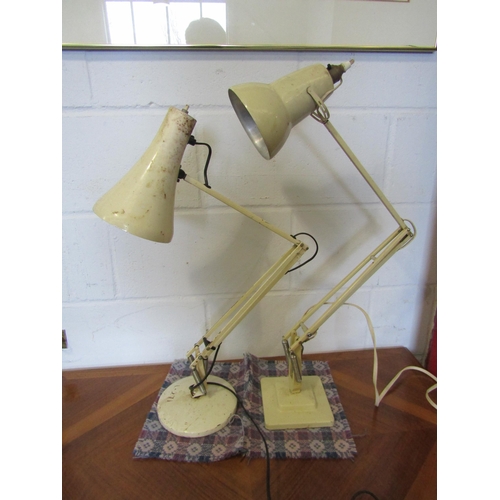 1100 - A Herbert Terry cream lamp together with another (2)