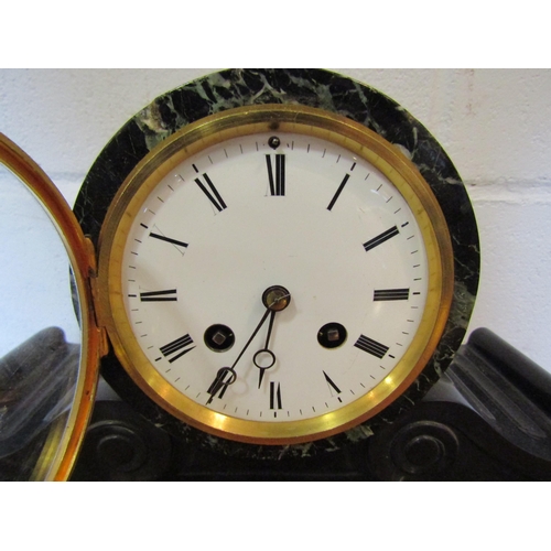 1101 - A French slate and marble mantel clock, Roman numerated dial, with key and pendulum, 23cm tall x 35c... 