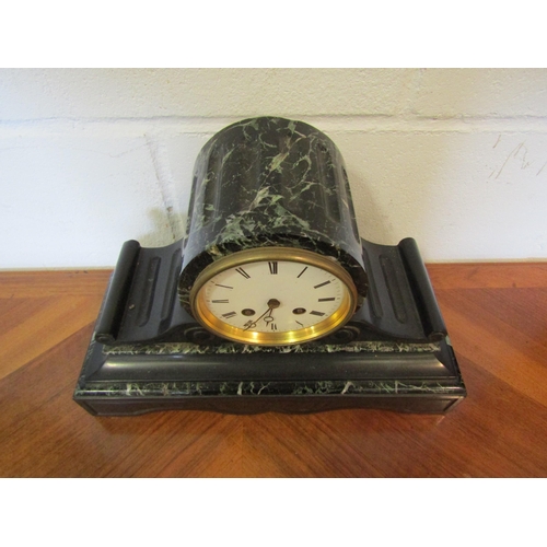 1101 - A French slate and marble mantel clock, Roman numerated dial, with key and pendulum, 23cm tall x 35c... 