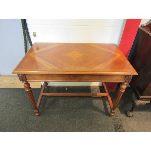 1102 - A French walnut side table, concealed single frieze drawer, on turned and reeded supports, stretcher... 