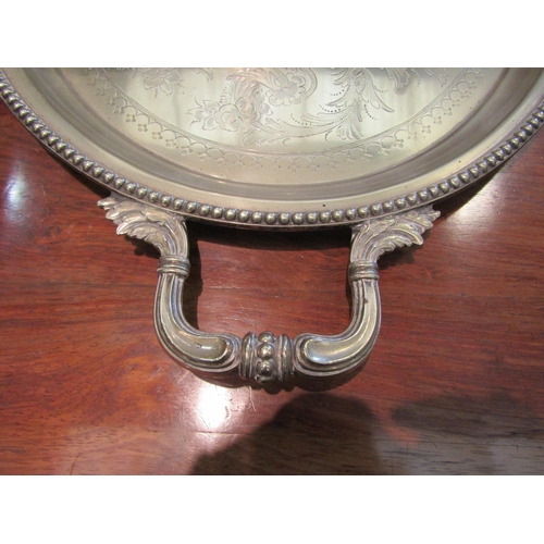 1114 - A plated twin handled tray with gadrooned rim, vacant cartouche, 76cm long