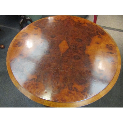 1148 - A 19th Century walnut breakfast table, quarter veneered top, shaped frieze, on ball and claw cabriol... 