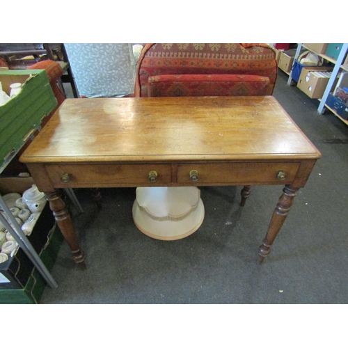 1157 - A 19th Century oak side table two drawers on turned legs, stains to top, 76cm tall x 106cm wide x 52... 