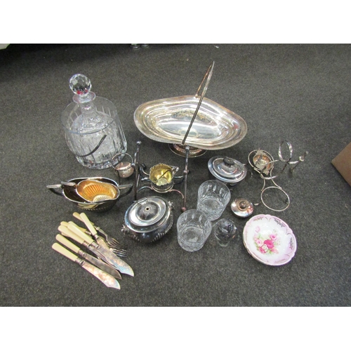 1185 - A box containing silver plate and glassware to include ice basket, decanter, plated cake basket, suc... 