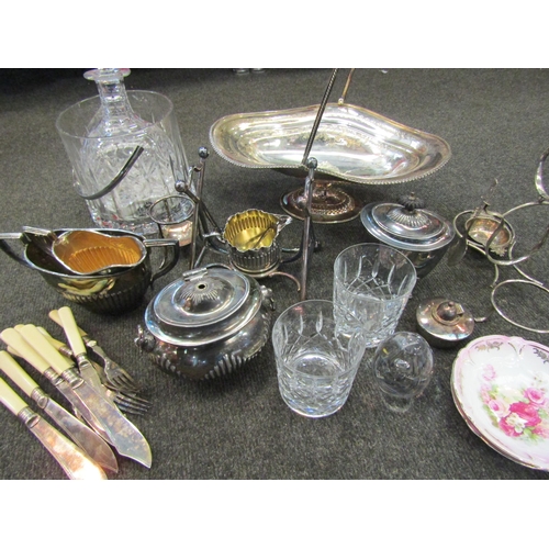 1185 - A box containing silver plate and glassware to include ice basket, decanter, plated cake basket, suc... 