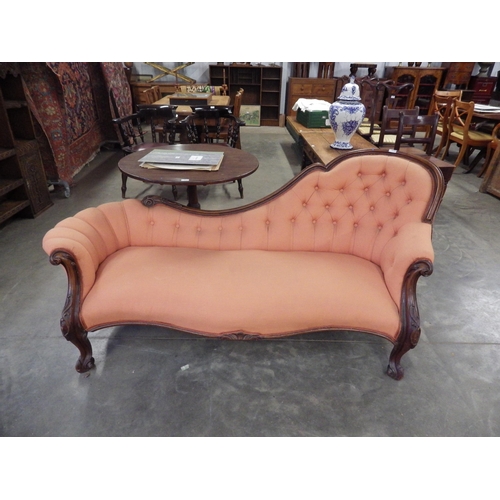 2148 - A Victorian carved walnut spoon back sofa